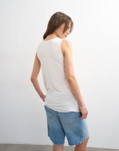 Model wearing Drape side detail tank top in white