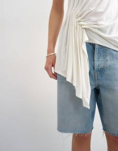 Model wearing Drape side detail tank top in white