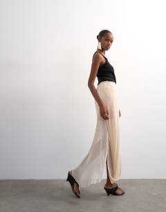 Model wearing Draped pleated fabric maxi skirt in ivory
