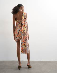 Model wearing Draped scarf neck mini dress in mosaic print