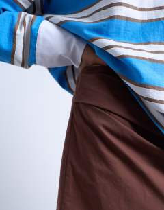 Model wearing Draped tuckside mini skirt in chocolate brown