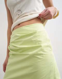 Model wearing Draped tuckside mini skirt in lime