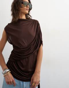 Model wearing Draped wrap high cap sleeve top in chocolate brown