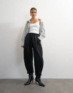 Model wearing Drawcord techy balloon trousers in black