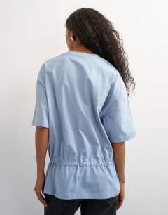 Model wearing Drawstring hem tee in dusty blue