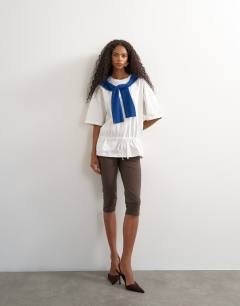Model wearing Drawstring hem tee in white