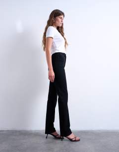 Model wearing Dree high rise slim straight leg jean in black