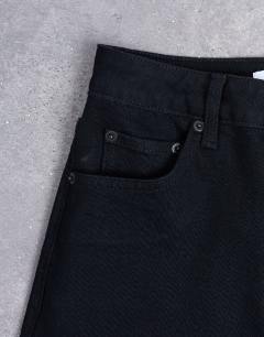 Model wearing Dree high rise slim straight leg jean in black