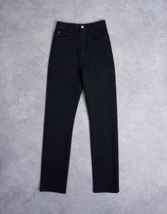 Model wearing Dree high rise slim straight leg jean in black