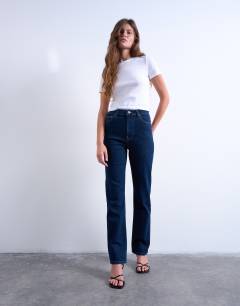 Model wearing Dree high rise slim straight leg jean in indigo rinse