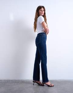 Model wearing Dree high rise slim straight leg jean in indigo rinse