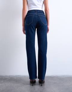 Model wearing Dree high rise slim straight leg jean in indigo rinse