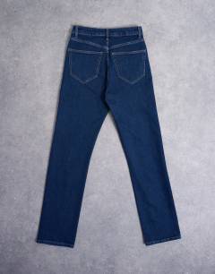 Model wearing Dree high rise slim straight leg jean in indigo rinse