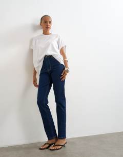 Model wearing Dree high rise slim straight leg jean in indigo rinse