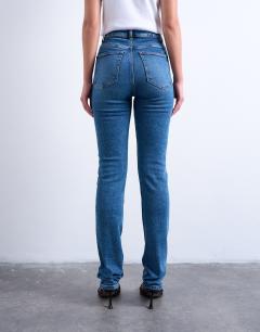 Model wearing Dree high rise slim straight leg jean in mid blue