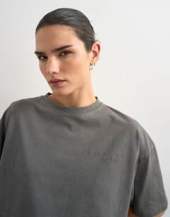 Model wearing Drop shoulder mercer graphic print tee in washed black