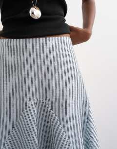 Model wearing Drop waist godet hem crinkle skirt in mono stripe