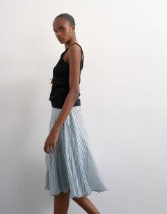 Model wearing Drop waist godet hem crinkle skirt in mono stripe
