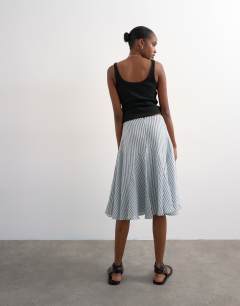 Model wearing Drop waist godet hem crinkle skirt in mono stripe