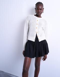 Drop waist mini skirt in black