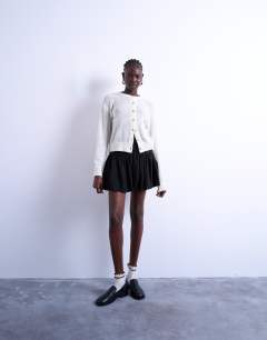 Model wearing Drop waist mini skirt in black