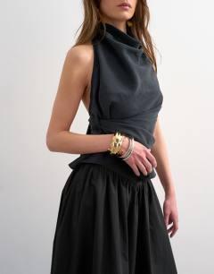 Model wearing Drop waist saloon maxi skirt in black