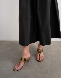 Model wearing Drop waist saloon maxi skirt in black