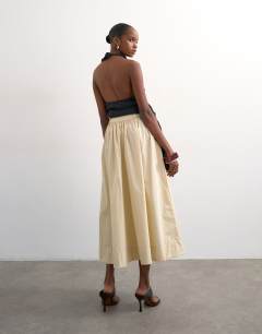 Model wearing Drop waist saloon maxi skirt in buttermilk