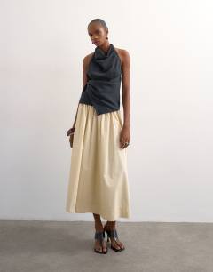 Model wearing Drop waist saloon maxi skirt in buttermilk