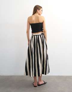 Model wearing Drop waist saloon maxi skirt in mono stripe print