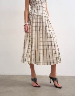 Model wearing Drop waist saloon maxi skirt in window pane check