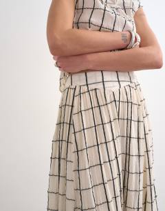 Model wearing Drop waist saloon maxi skirt in window pane check
