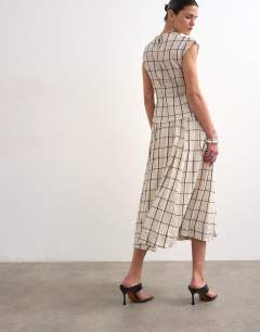 Model wearing Drop waist saloon maxi skirt in window pane check