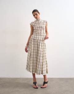 Model wearing Drop waist saloon maxi skirt in window pane check