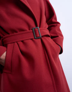 Model wearing Dropped belt longline formal coat in red