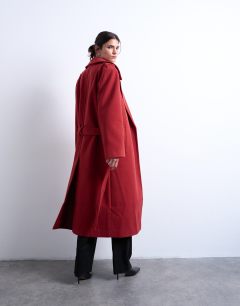 Model wearing Dropped belt longline formal coat in red