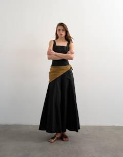 Model wearing Dropped hem full circle skirt sundress in black