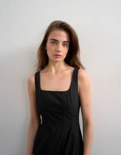 Model wearing Dropped hem full circle skirt sundress in black