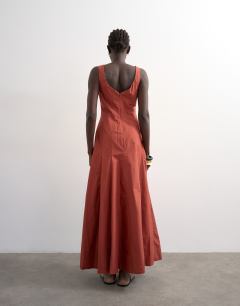 Model wearing Dropped hem full circle skirt sundress in rust