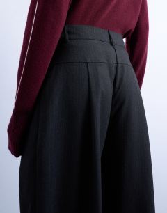 Model wearing Dropped waist barrel trouser in grey stripe herringbone