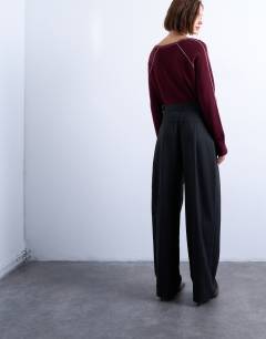 Model wearing Dropped waist barrel trouser in grey stripe herringbone