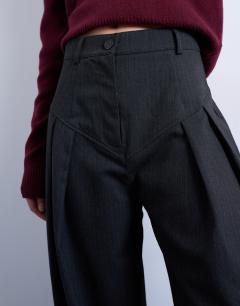Model wearing Dropped waist barrel trouser in grey stripe herringbone