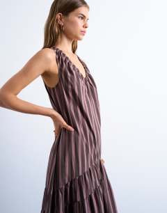 Model wearing Dropped waist chuck on poplin midi dress in pink and choc stripe