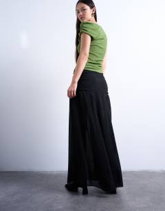 Model wearing Dropped waist draped fabric maxi skirt in black
