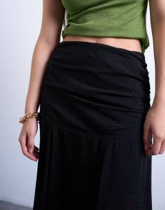 Model wearing Dropped waist draped fabric maxi skirt in black