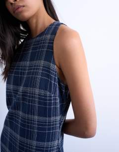 Model wearing Dropped waist full circle hem midi dress in navy check