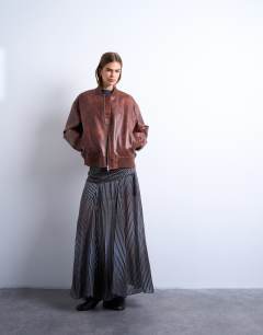 Model wearing Dropped waist full hem maxi skirt in  stripe