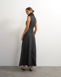 Model wearing Dropped waist funnel neck maxi dress in rust woven stripe