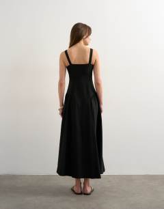 Model wearing Dropped waist maxi dress in black