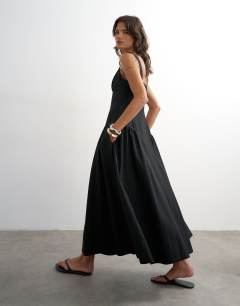 Model wearing Dropped waist maxi dress in black